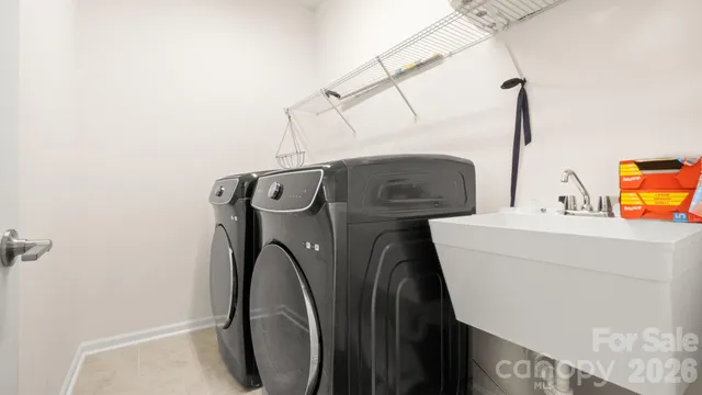 a utility room with dryer and washer