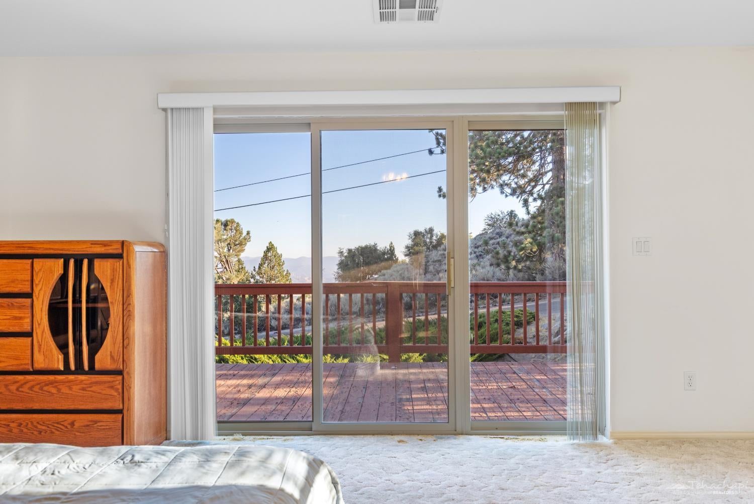 26681 Stirrup Way Tehachapi, CA 93561 - Photo 22 of 55 Primary suite's sliding glass door to the front 2nd floor deck...
