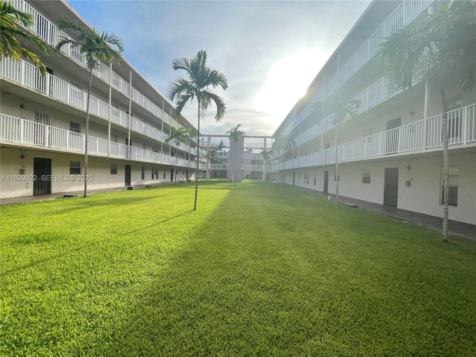 2800 Northwest 56th Avenue, Unit E103 Lauderhill, FL 33313 - Photo 10 of 15 a view of an apartment with a big yard