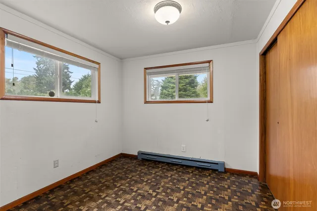 a view of room with window and hallway