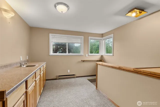 a room with a window and a sink