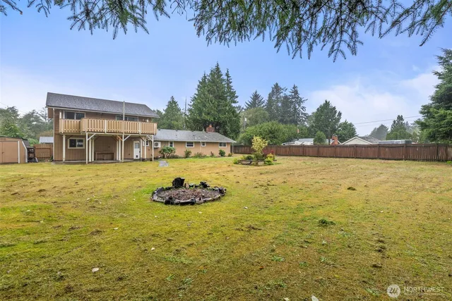 a swimming pool with outdoor seating and yard