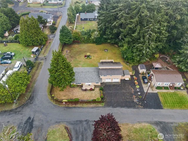 an aerial view of a house with yard swimming pool and outdoor seating