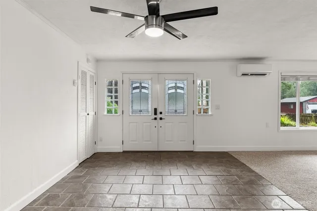 a view of a big room with windows and cabinet