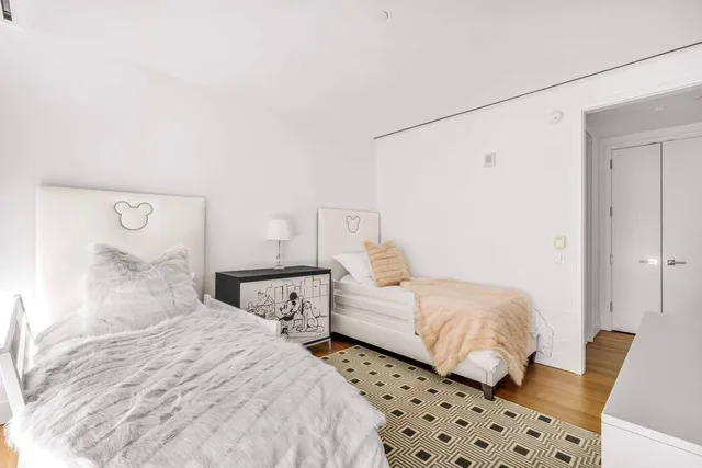 a bathroom with a sink toilet vanity and shower