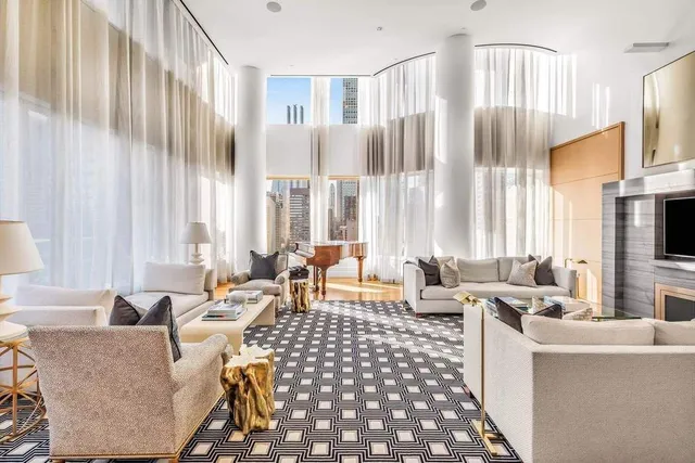 a bathroom with a granite countertop sink and a large mirror