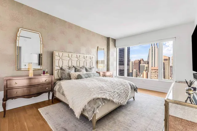 a bathroom with a sink toilet and a mirror