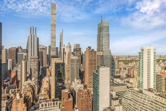 a spacious bedroom with a bed and a large window