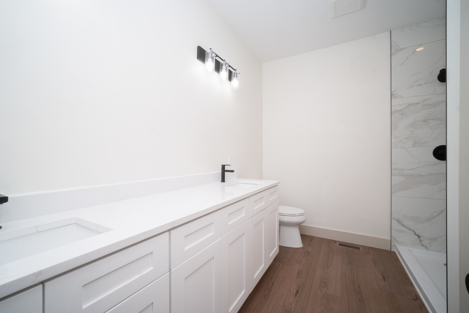 550 Cross Plains Road Rockford, IL 61107 - Photo 22 of 34 a bathroom with a sink a toilet and shower