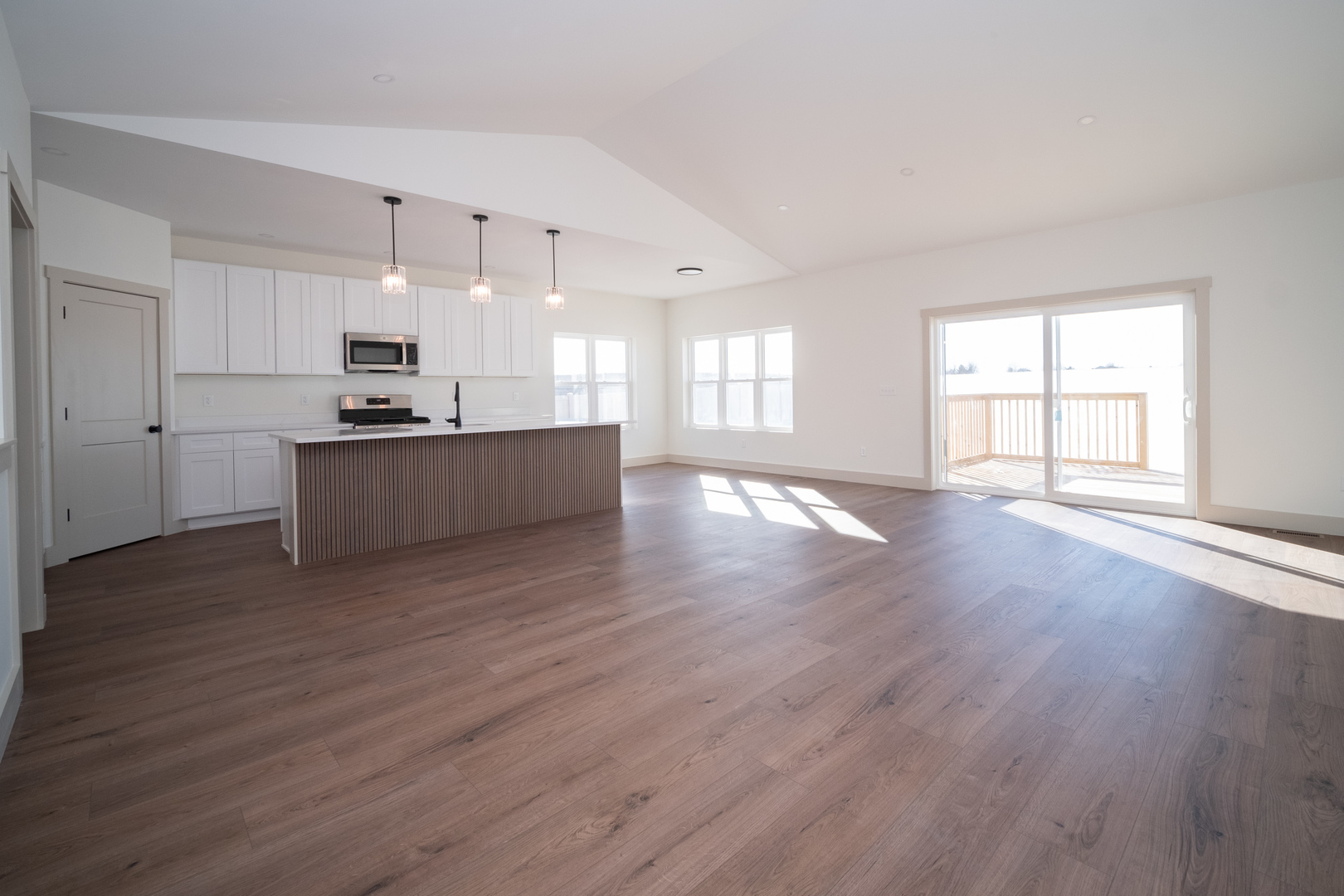 550 Cross Plains Road Rockford, IL 61107 - Photo 5 of 34 a large kitchen with a wooden floor and a large window