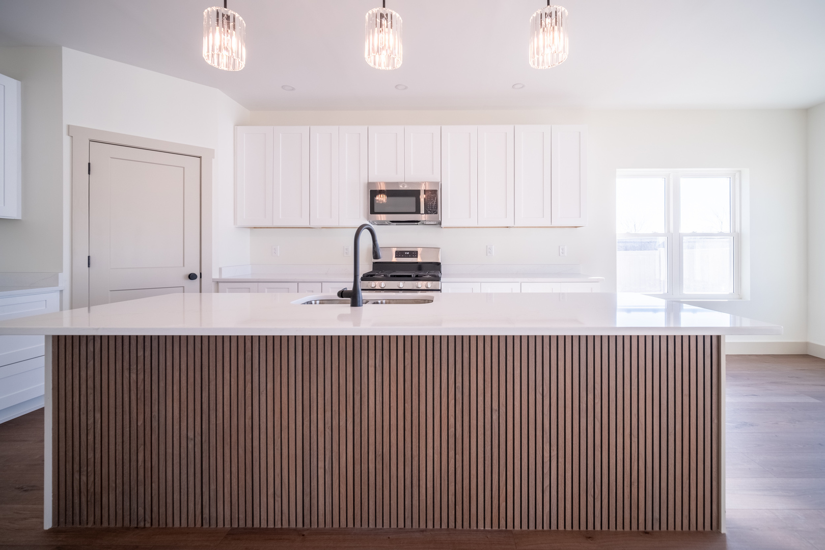 550 Cross Plains Road Rockford, IL 61107 - Photo 9 of 34 a kitchen with a sink a microwave and cabinets