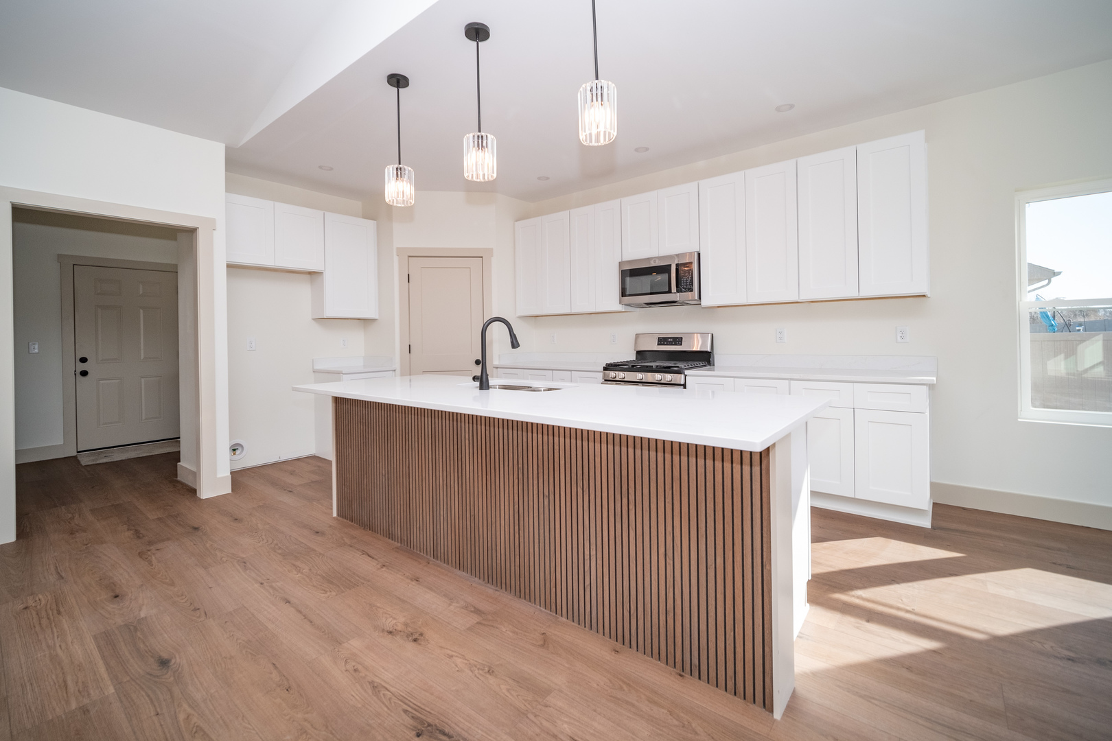 550 Cross Plains Road Rockford, IL 61107 - Photo 10 of 34 a kitchen with kitchen island a sink stainless steel appliances and cabinets