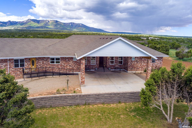 422 South Creek Road Monticello, UT 84535 - Photo 3 of 59 View of front of house with a mountain view