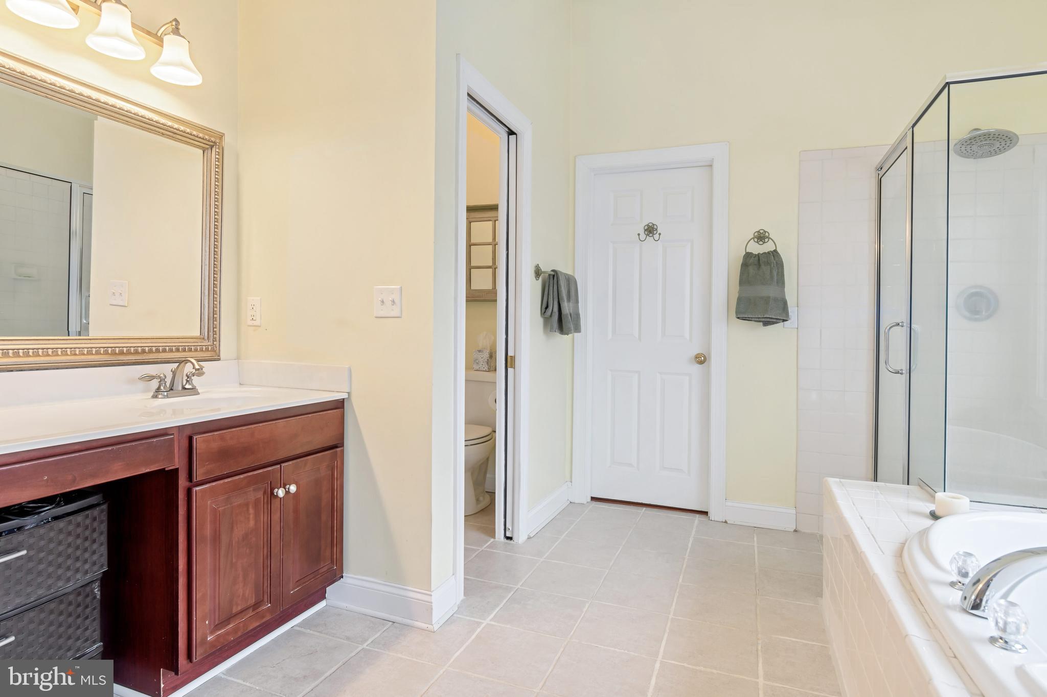 5855 Bethlehem Road Preston, MD 21655 - Photo 34 of 43 a bathroom with a sink double vanity and a mirror