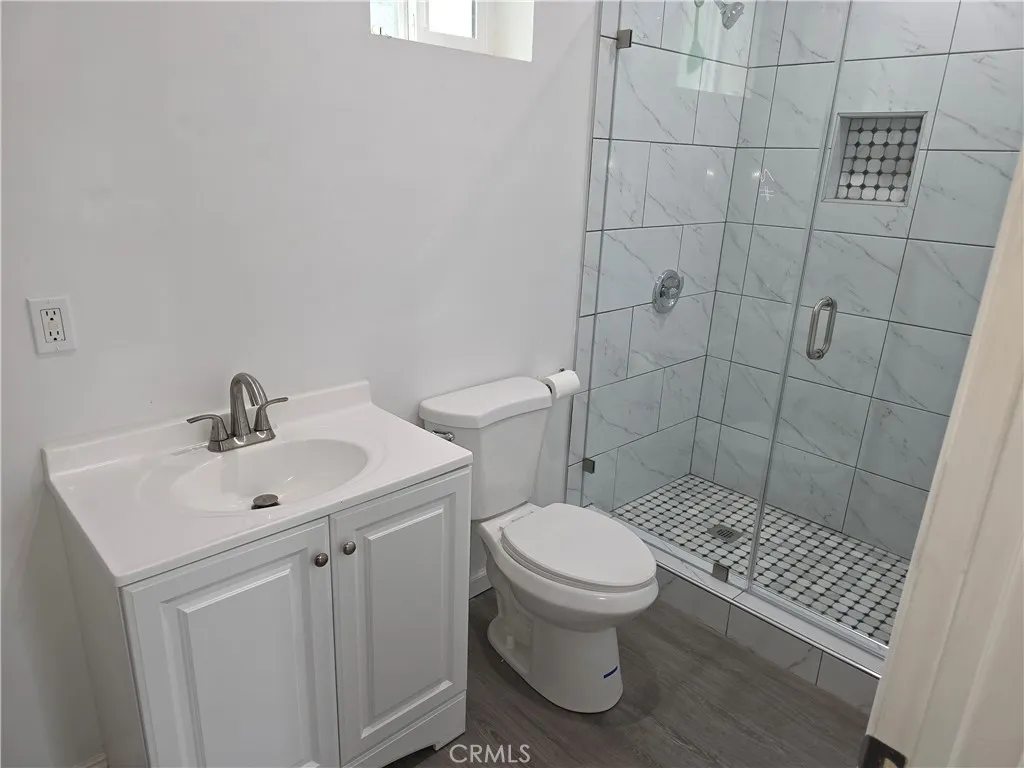 5417 Baltimore Street Los Angeles, CA 90042 - Photo 8 of 9 a bathroom with a sink toilet and shower