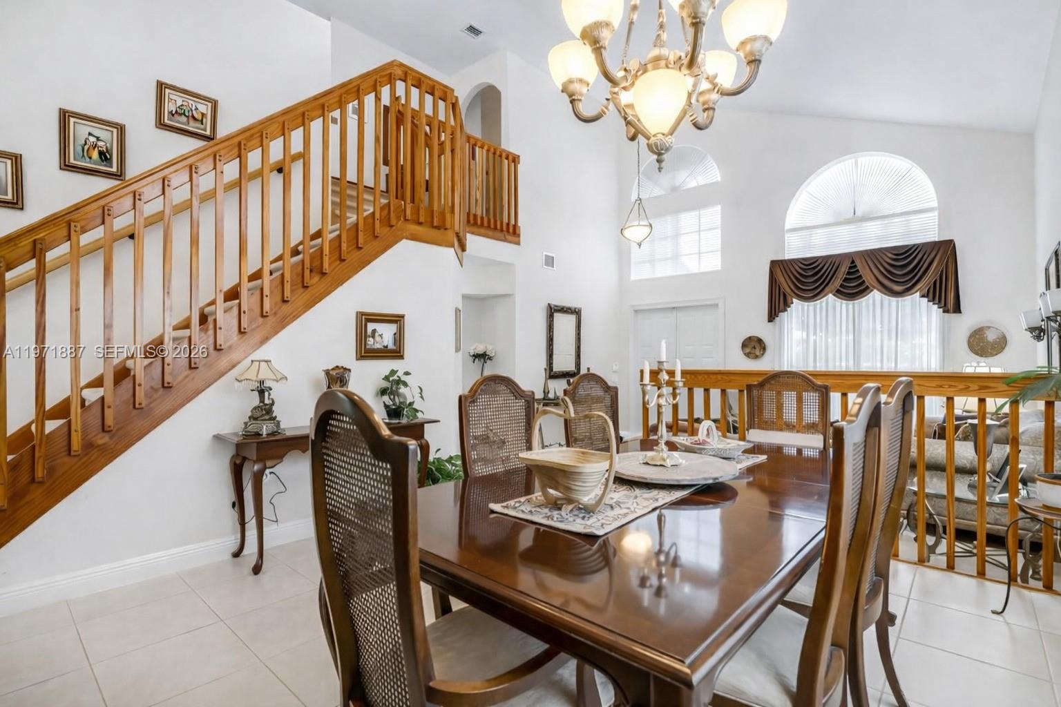5321 Southwest 184th Way Miramar, FL 33029 - Photo 11 of 43 a view of a dining room with furniture and a chandelier