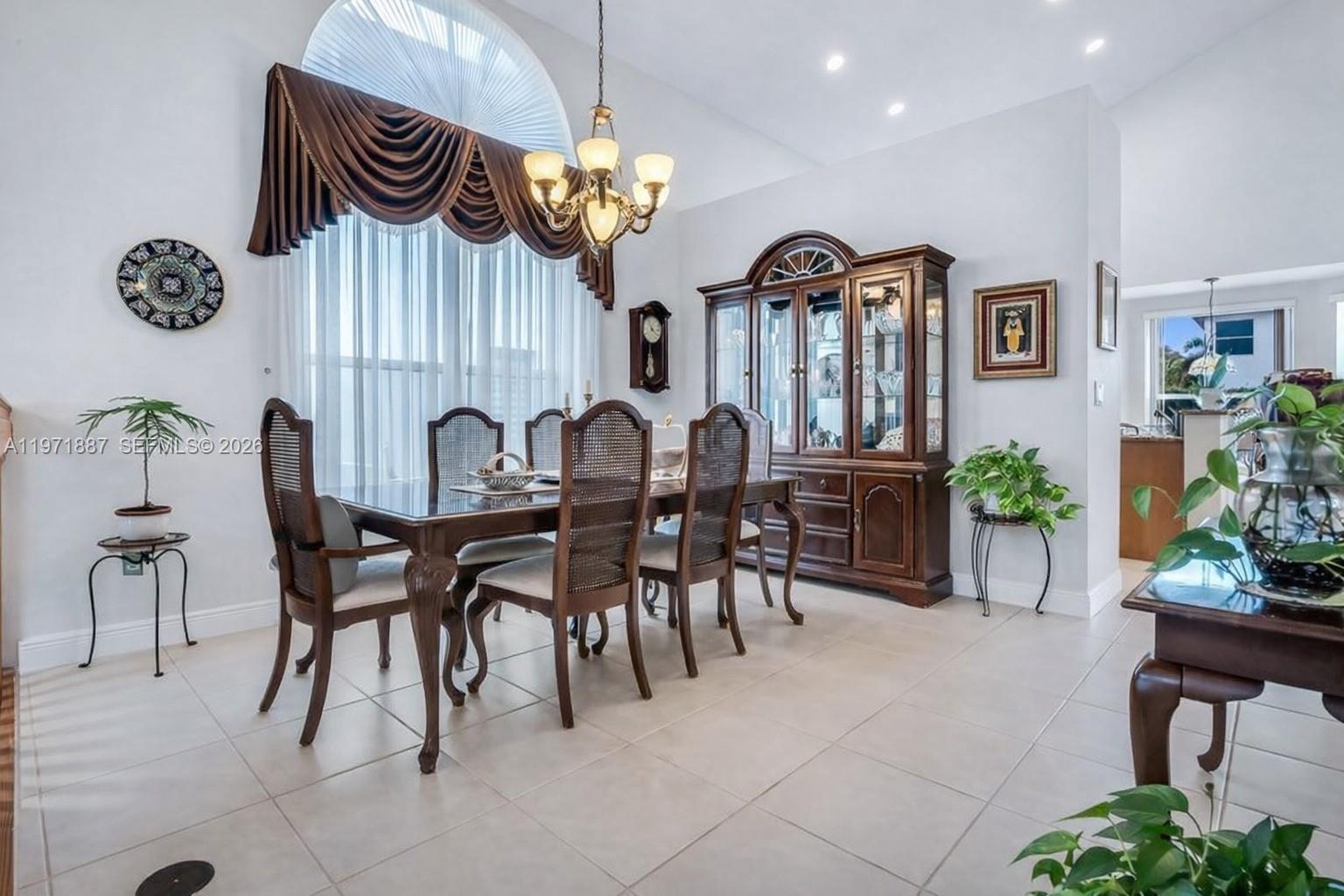 5321 Southwest 184th Way Miramar, FL 33029 - Photo 12 of 43 a view of a dining room that has a table and chairs