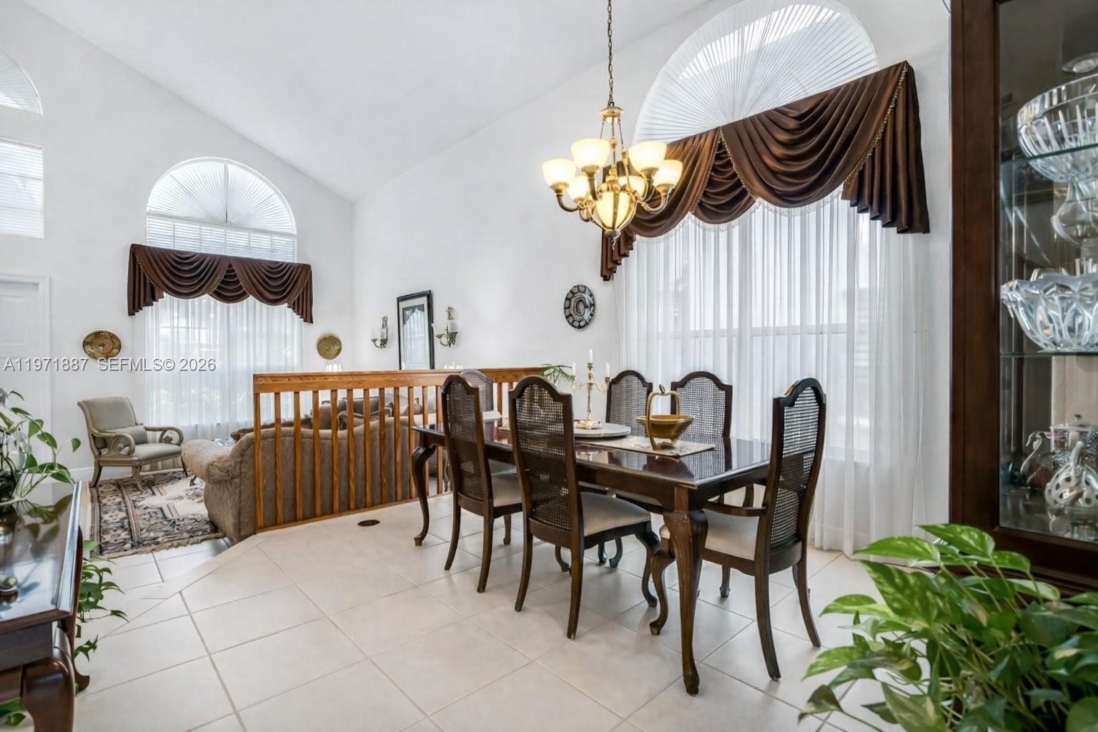 5321 Southwest 184th Way Miramar, FL 33029 - Photo 13 of 43 a view of a dining room with furniture and chandelier