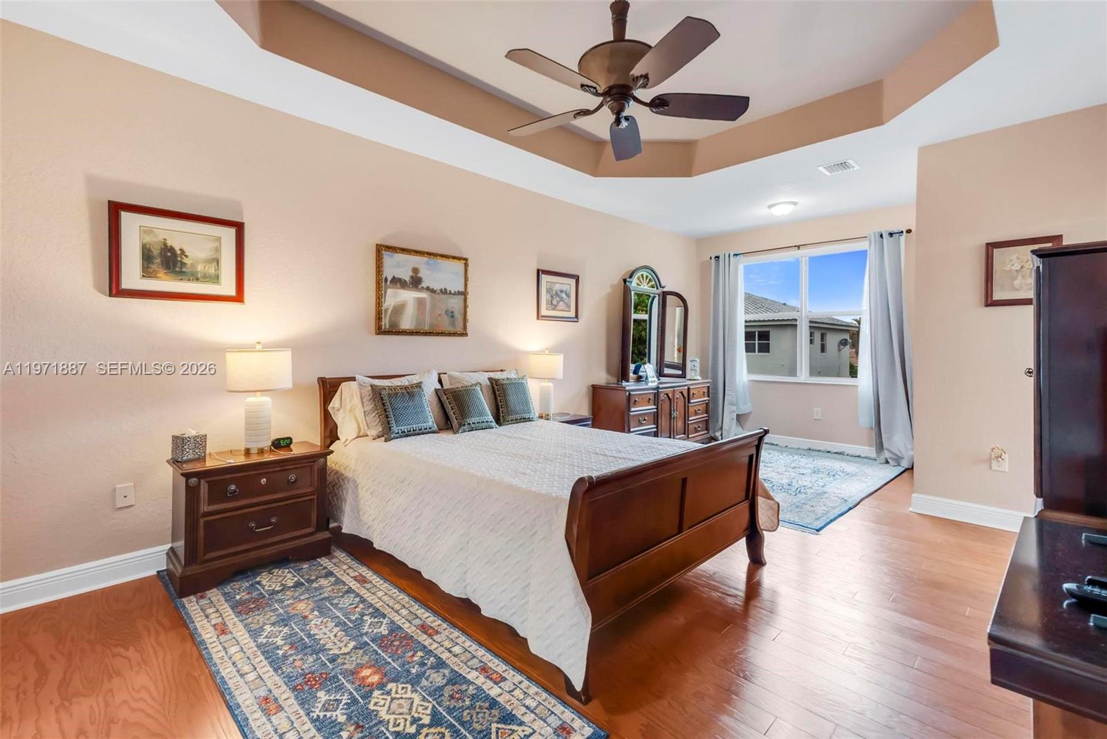5321 Southwest 184th Way Miramar, FL 33029 - Photo 17 of 43 a bed room with a bed and a chandelier