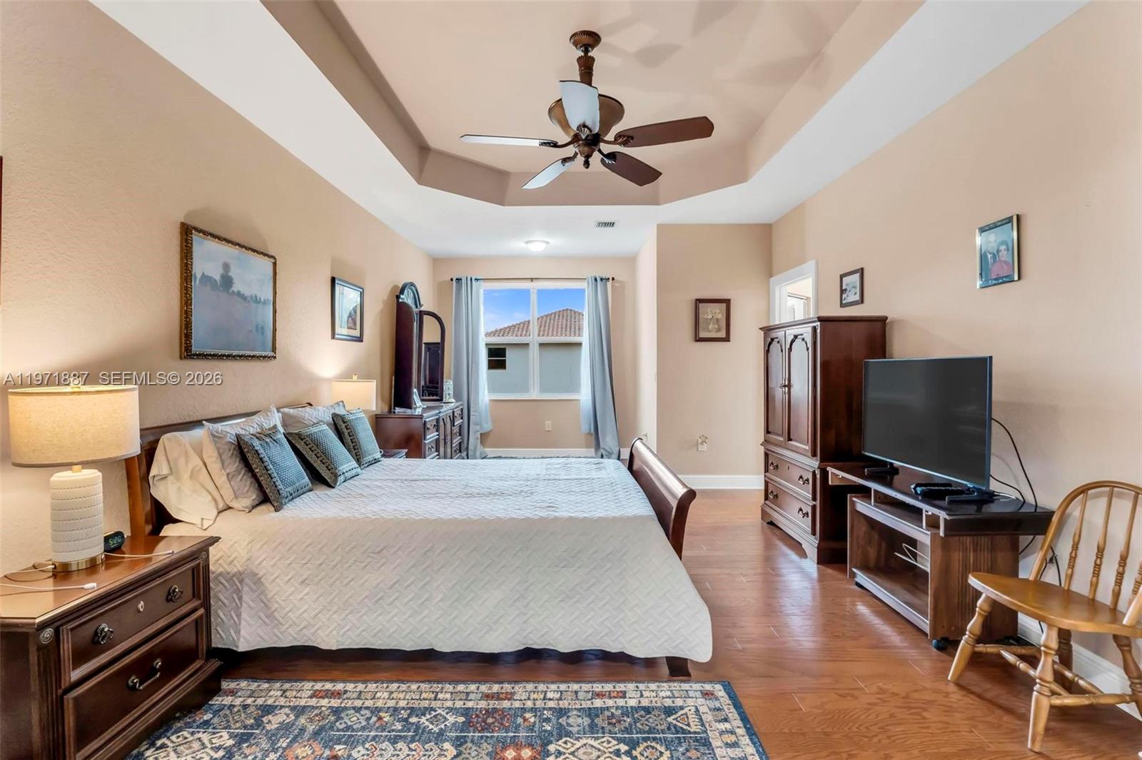 5321 Southwest 184th Way Miramar, FL 33029 - Photo 19 of 43 a bedroom with a bed and a flat screen tv