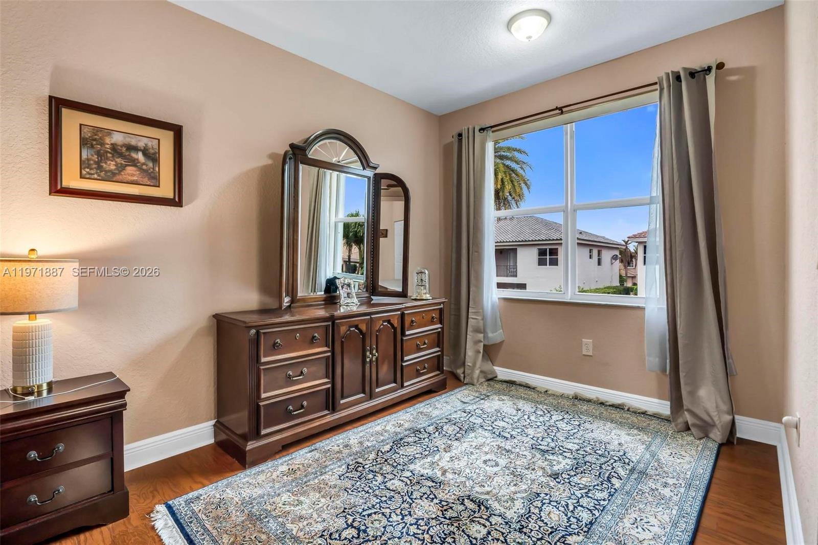 5321 Southwest 184th Way Miramar, FL 33029 - Photo 20 of 43 a view of a bedroom with furniture and window