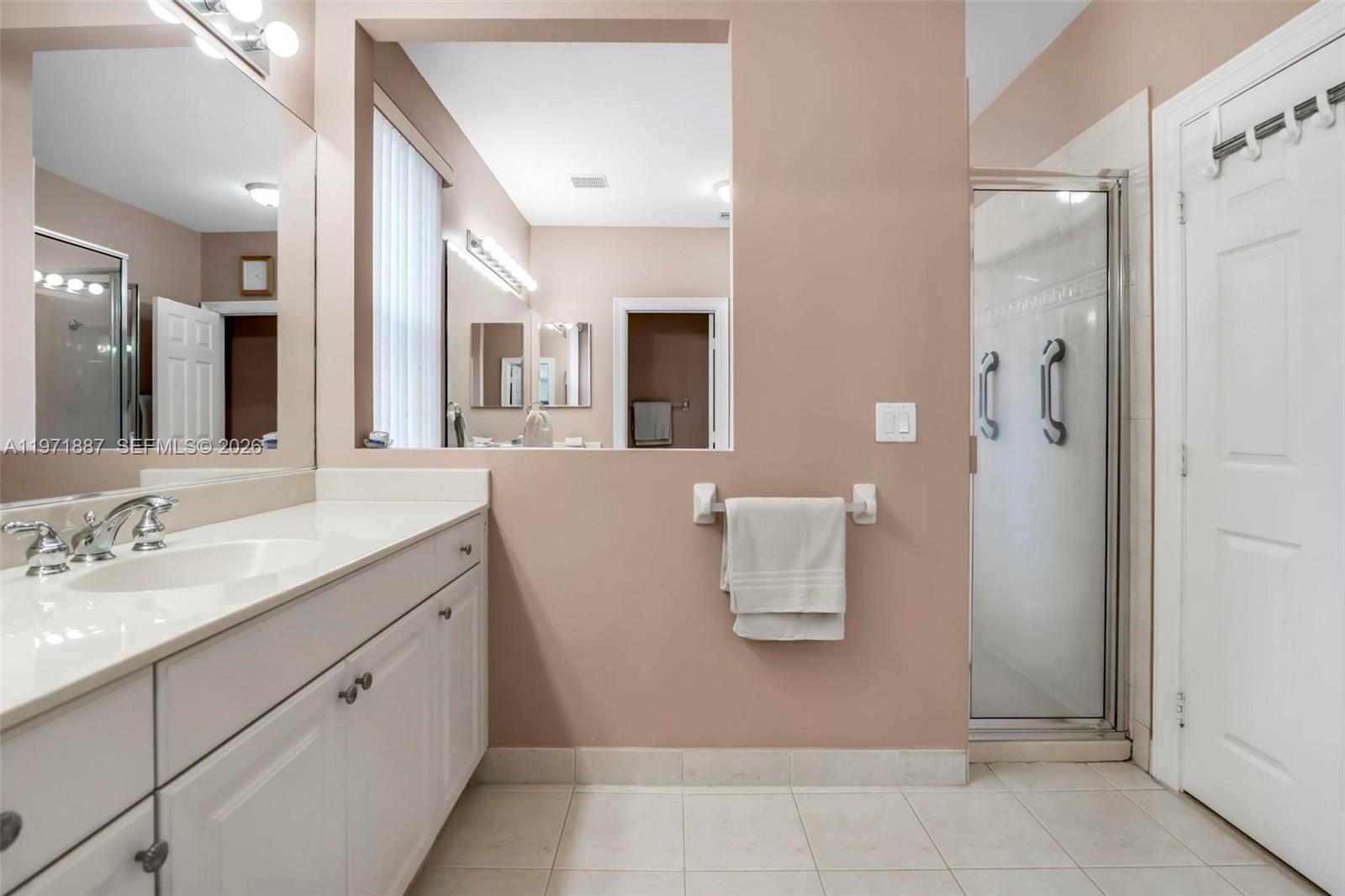 5321 Southwest 184th Way Miramar, FL 33029 - Photo 23 of 43 a bathroom with a sink and mirror