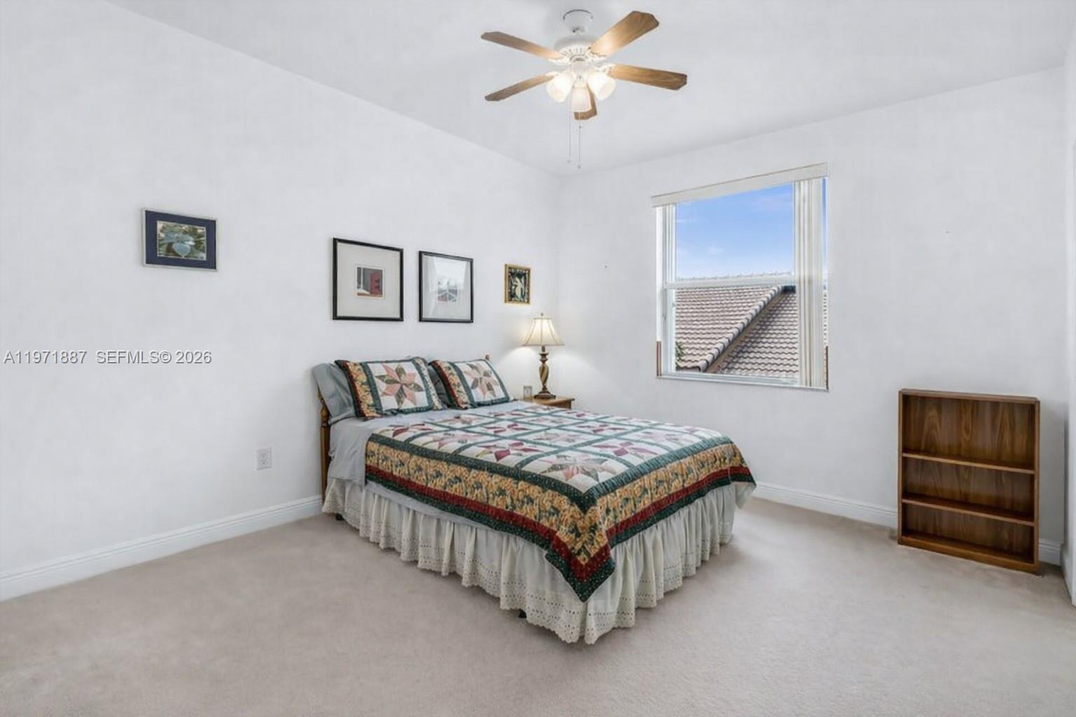 5321 Southwest 184th Way Miramar, FL 33029 - Photo 28 of 43 a bedroom with a bed and cabinet