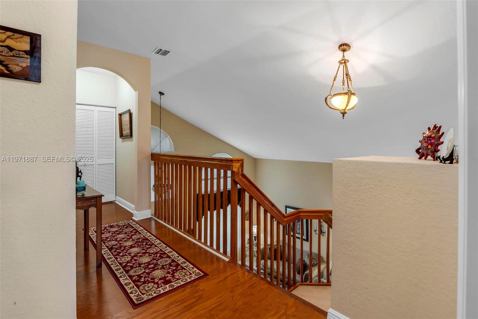 5321 Southwest 184th Way Miramar, FL 33029 - Photo 29 of 43 a view of a hallway with wooden floor and stairs