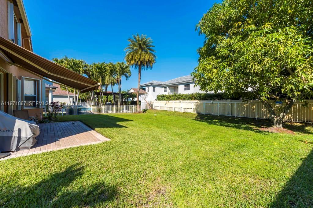 5321 Southwest 184th Way Miramar, FL 33029 - Photo 31 of 43 a view of a backyard with a garden