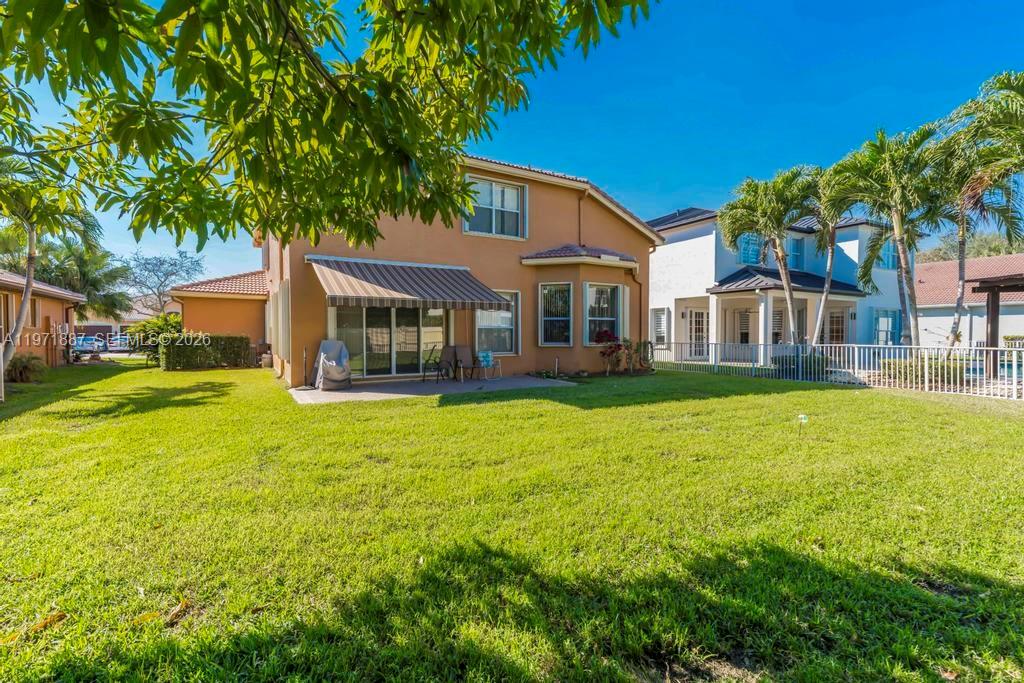 5321 Southwest 184th Way Miramar, FL 33029 - Photo 34 of 43 a front view of a house with garden