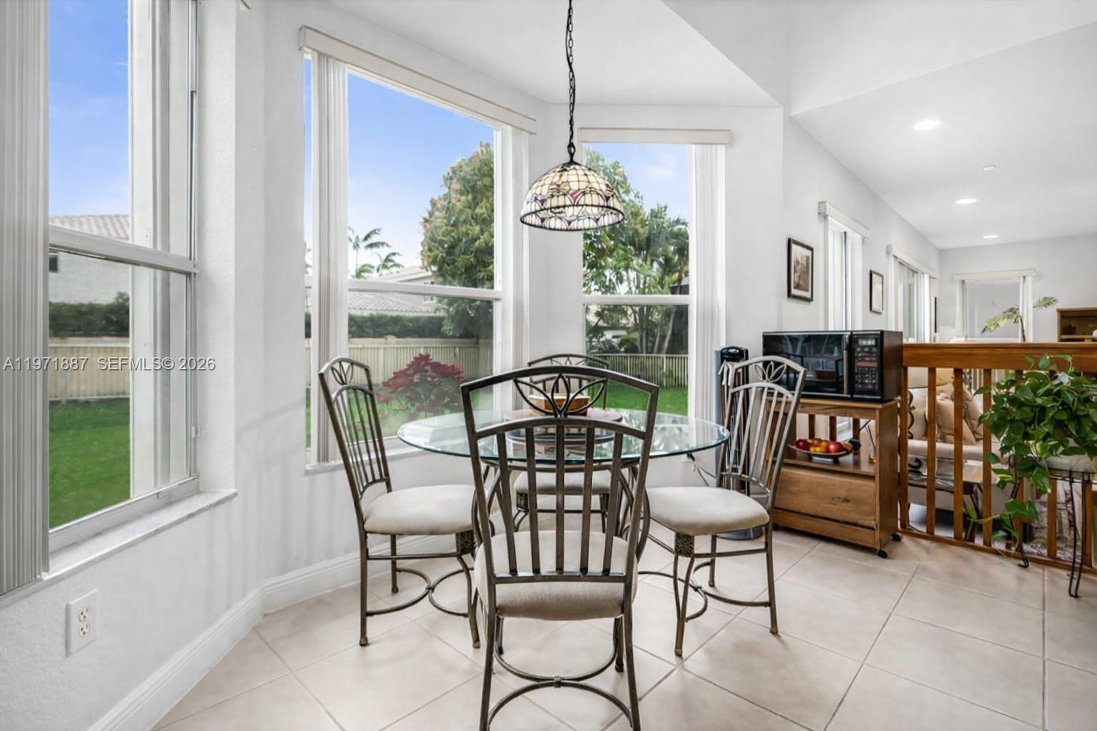 5321 Southwest 184th Way Miramar, FL 33029 - Photo 6 of 43 a view of a dining room with furniture window and wooden floor