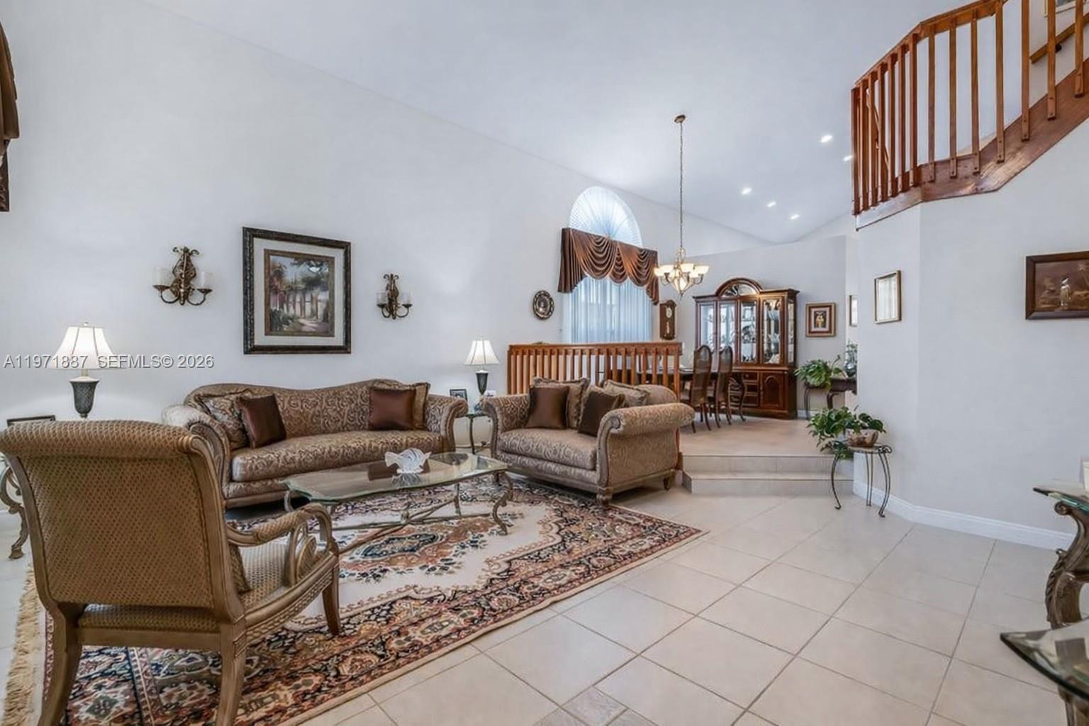 5321 Southwest 184th Way Miramar, FL 33029 - Photo 8 of 43 a living room with furniture a couch and paintings on the wall