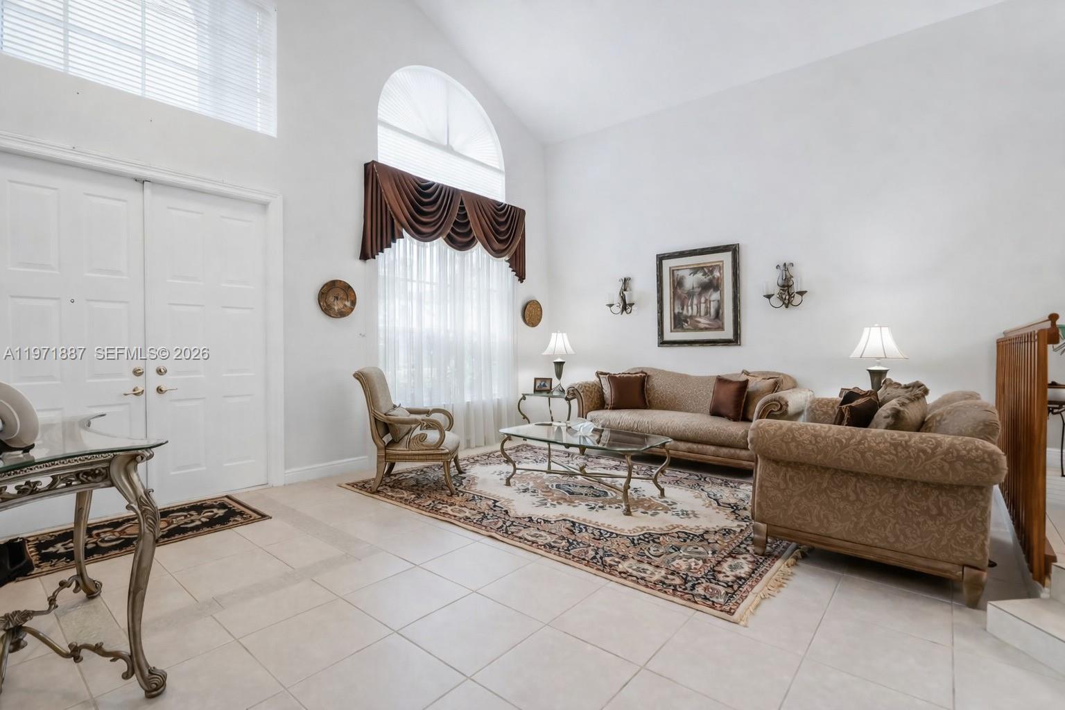 5321 Southwest 184th Way Miramar, FL 33029 - Photo 9 of 43 a living room with furniture and a table
