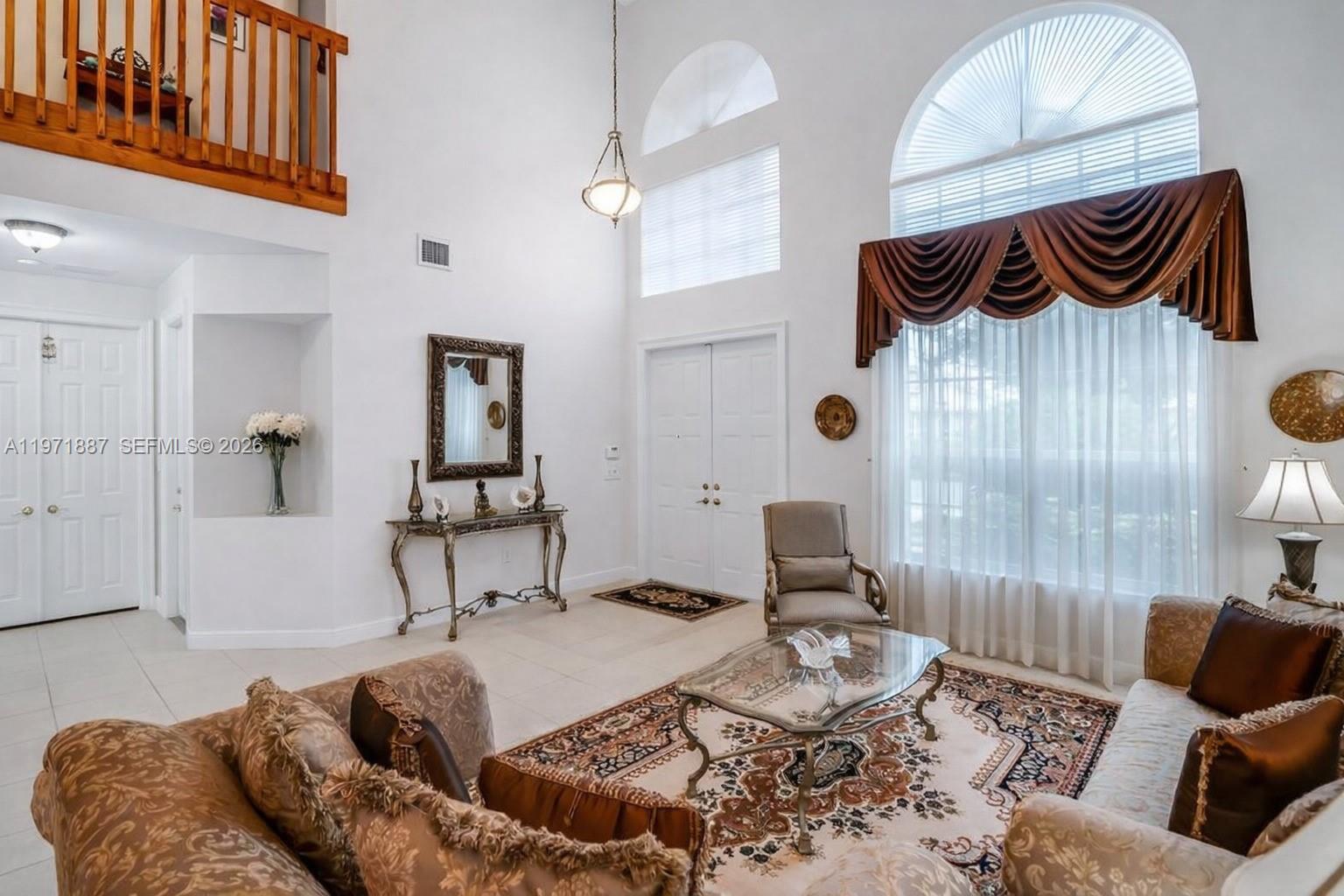 5321 Southwest 184th Way Miramar, FL 33029 - Photo 10 of 43 a living room with furniture and a rug