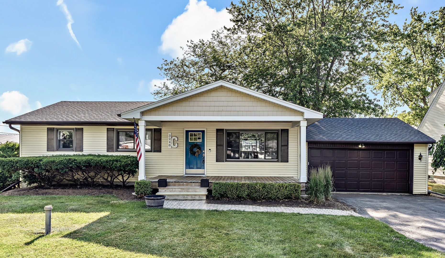 3248 River Road Kankakee, IL 60901 - Photo 1 of 32 a front view of a house with a yard and garage