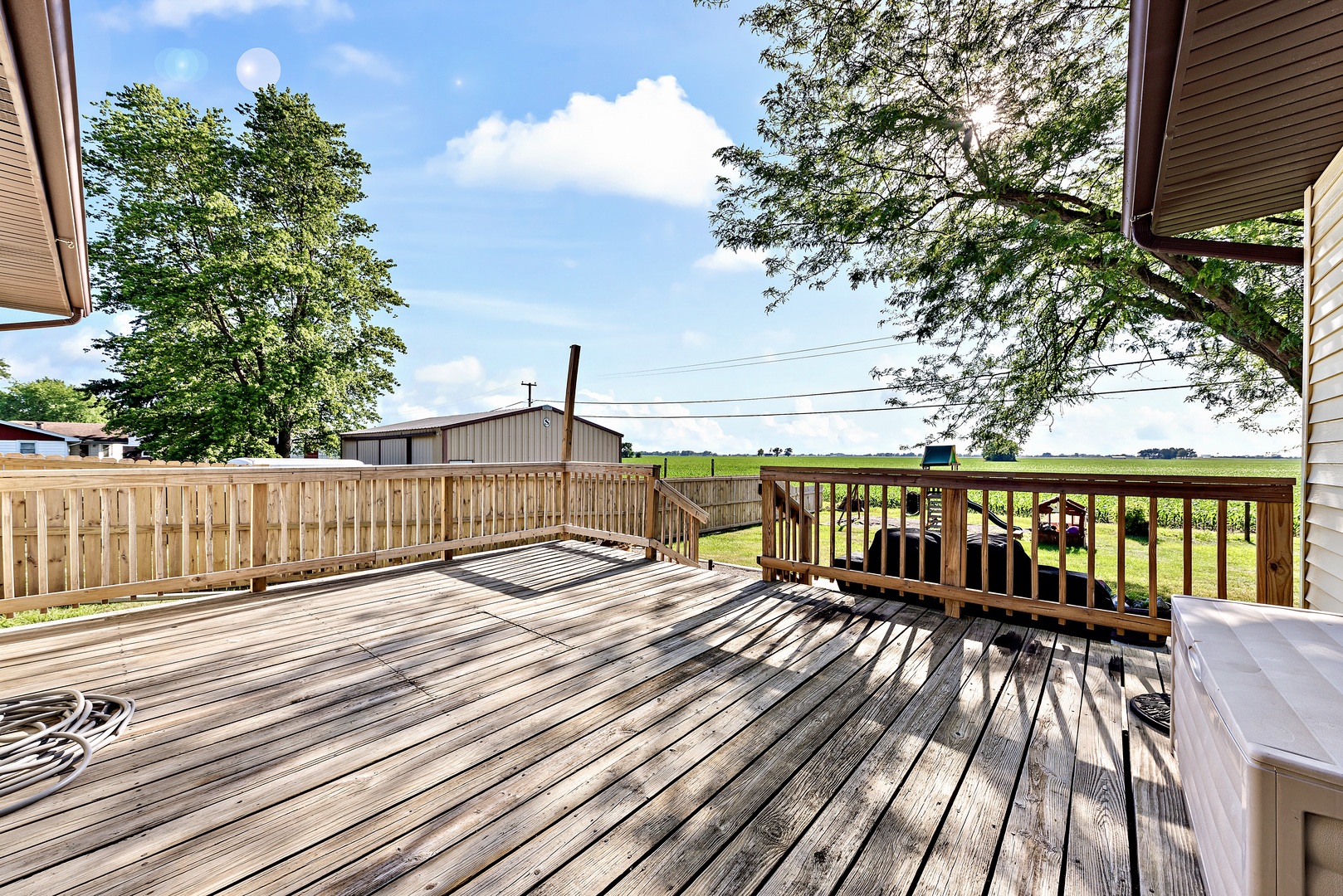3248 River Road Kankakee, IL 60901 - Photo 15 of 32 a balcony with wooden floor and fence