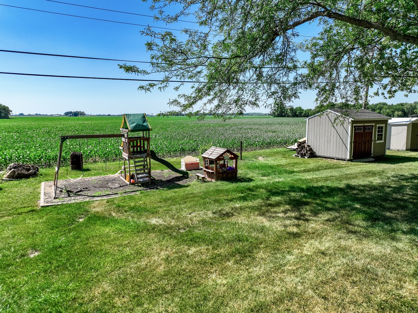 3248 River Road Kankakee, IL 60901 - Photo 25 of 32 a view of a house with backyard sitting area and garden