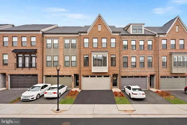 a car parked in front of a brick building
