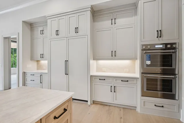 a spacious bedroom with a large bed and a window