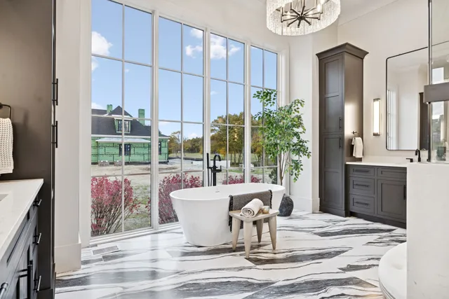 a view of an empty room with glass door and balcony
