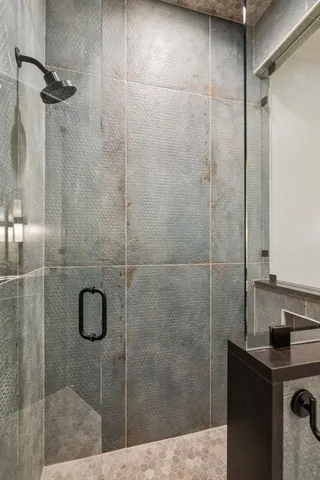 a picture of a bathroom with a shower