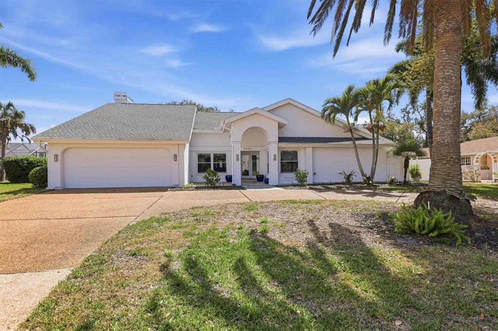 3906 Spyglass Hill Road Sarasota, FL 34238 - Photo 1 of 1 a front view of a house with a yard