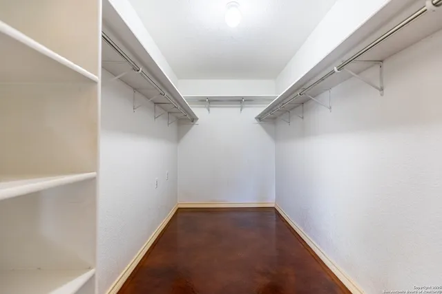 a bathroom with a double vanity sink mirror and toilet
