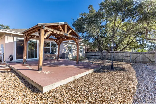 a view of a swimming pool with a patio