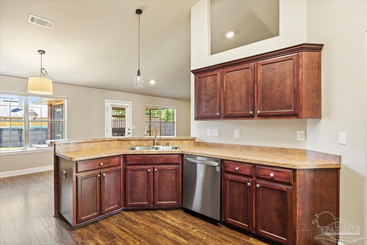 4015 Berry Circle Pace, FL 32571 - Photo 15 of 48 a kitchen with a sink and cabinets