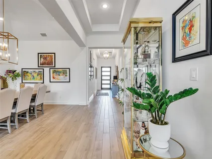 a view of a work space with furniture and wooden floor
