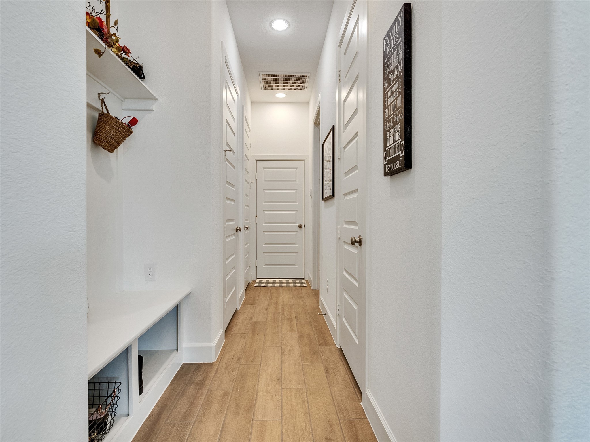 5422 Farm Hill Way Fulshear, TX 77406 - Photo 33 of 50 a view of a hallway with wooden floor and staircase