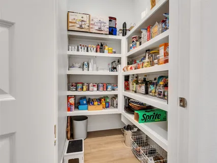 a room with book shelf and a shelf