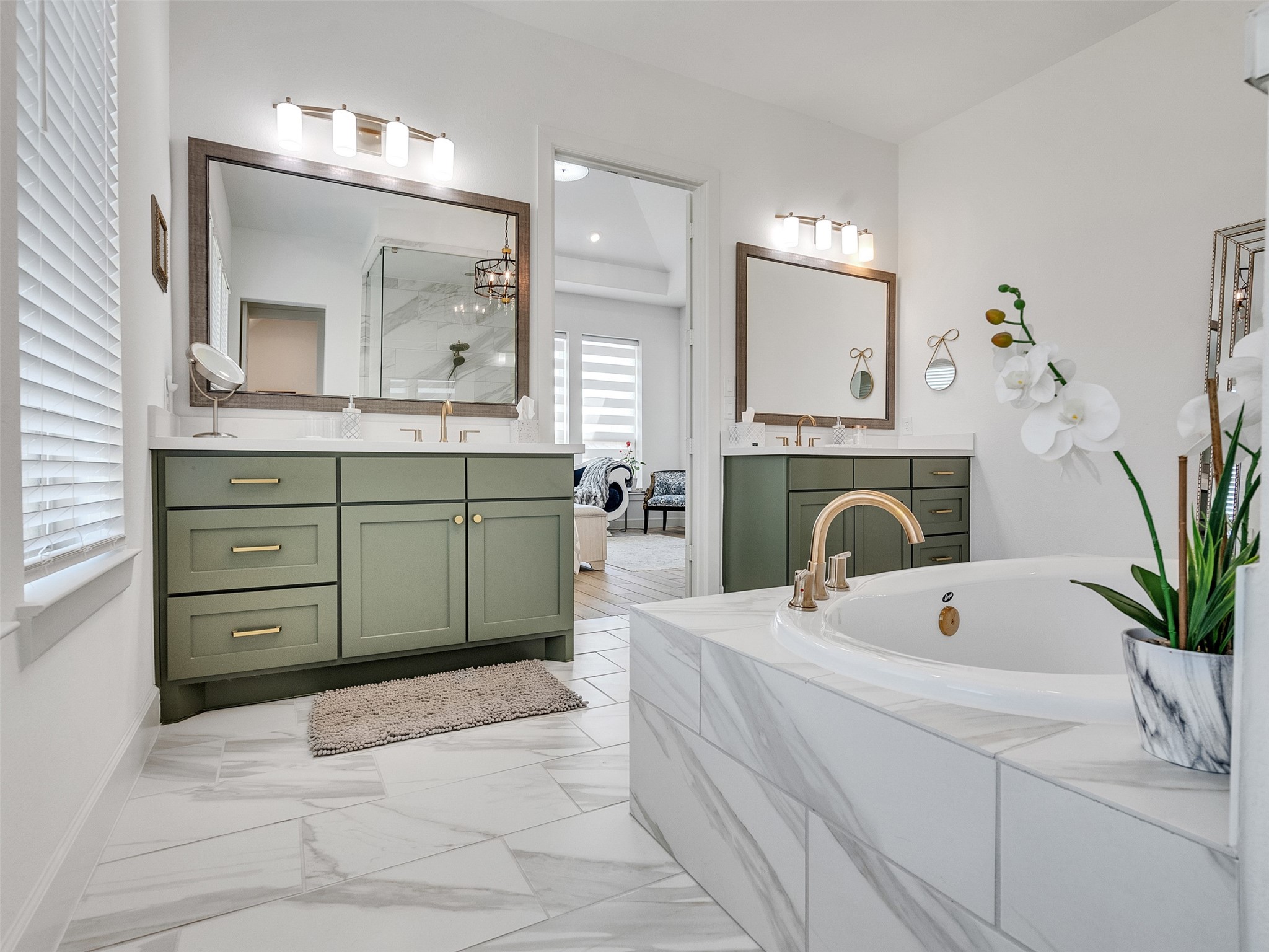 5422 Farm Hill Way Fulshear, TX 77406 - Photo 42 of 50 a spacious bathroom with a sink a large mirror and a bathtub
