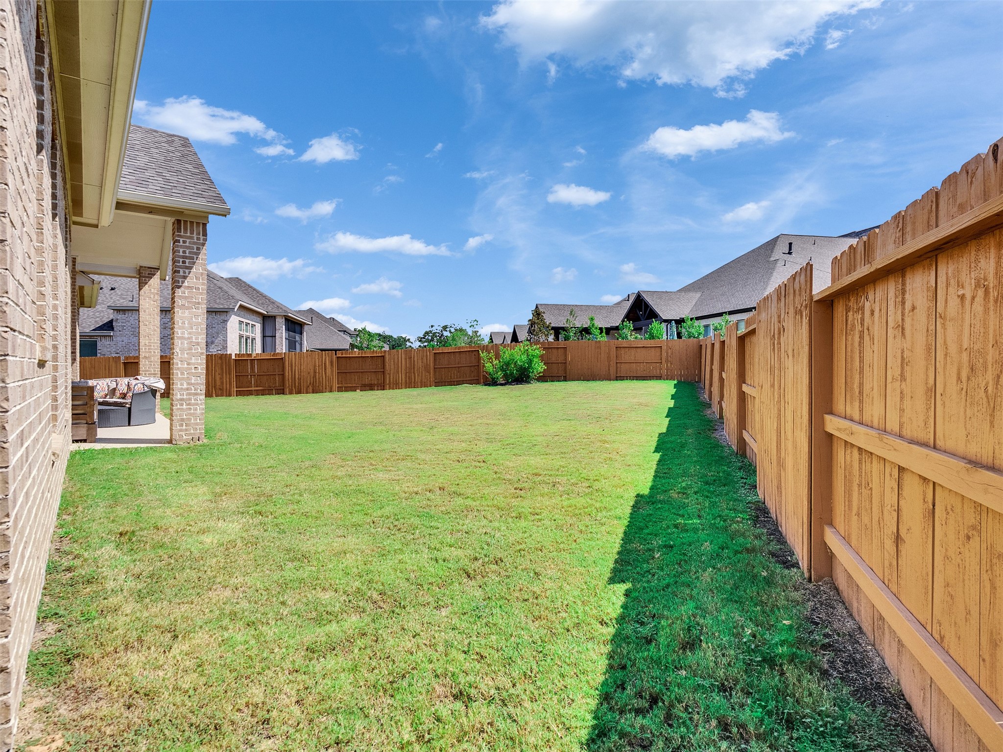 5422 Farm Hill Way Fulshear, TX 77406 - Photo 47 of 50 a view of a backyard with plants